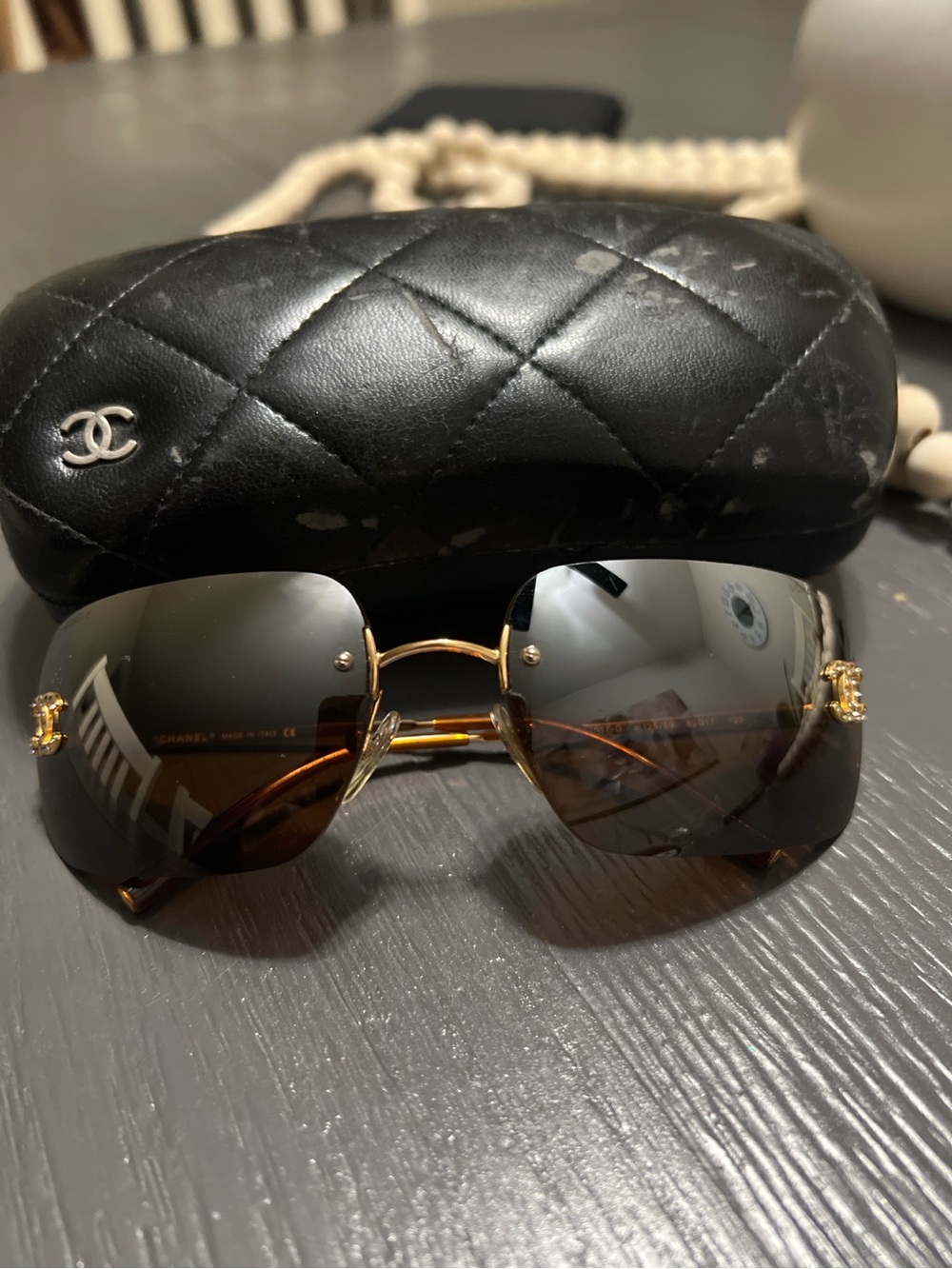 CHANEL Gold & Black Rimless Sunglasses with Brown Gradient Lenses
